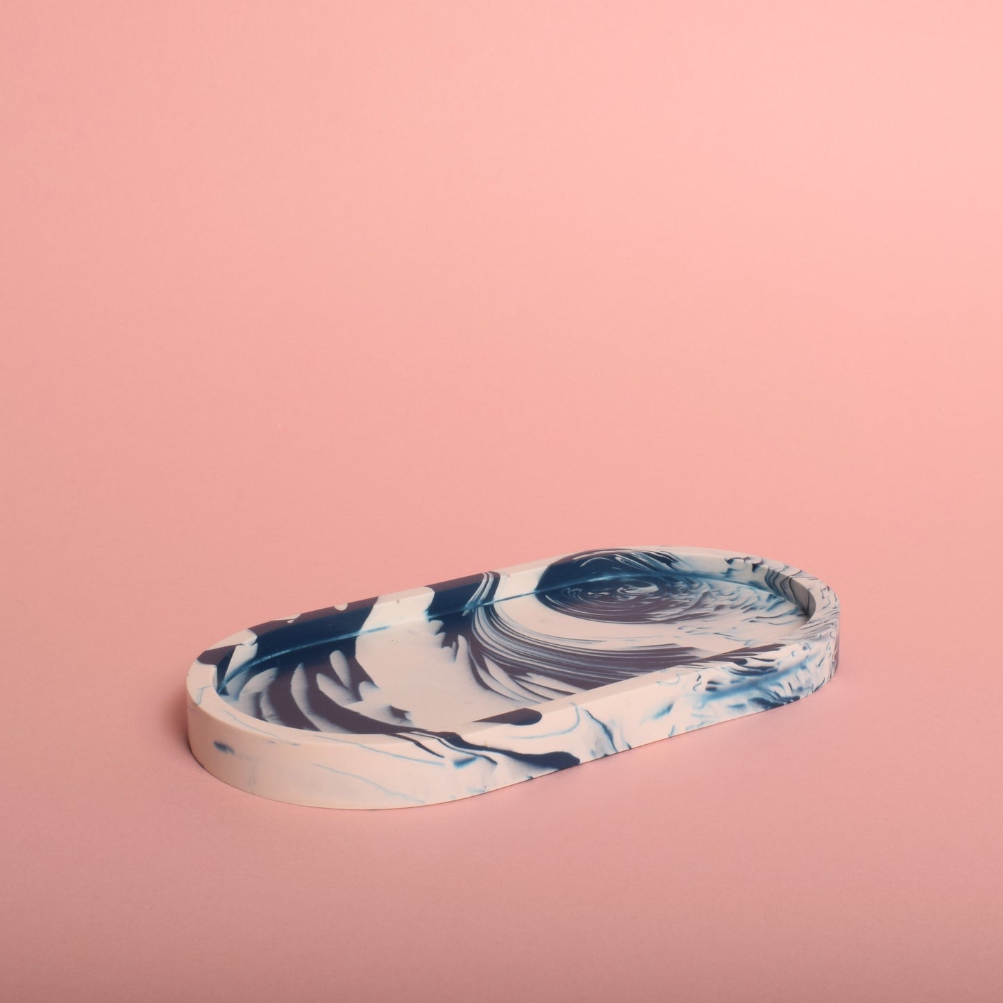 A navy blue and white marble effect oval trinket tray.